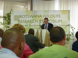 Permanent secretary of the Ministry of Environment Wildlife & Tourism, Mr Neil Fitt, opens the symposium.