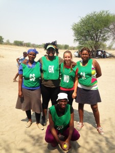 Members of the East Meets West netball team, with Masego and Hayley in the middle